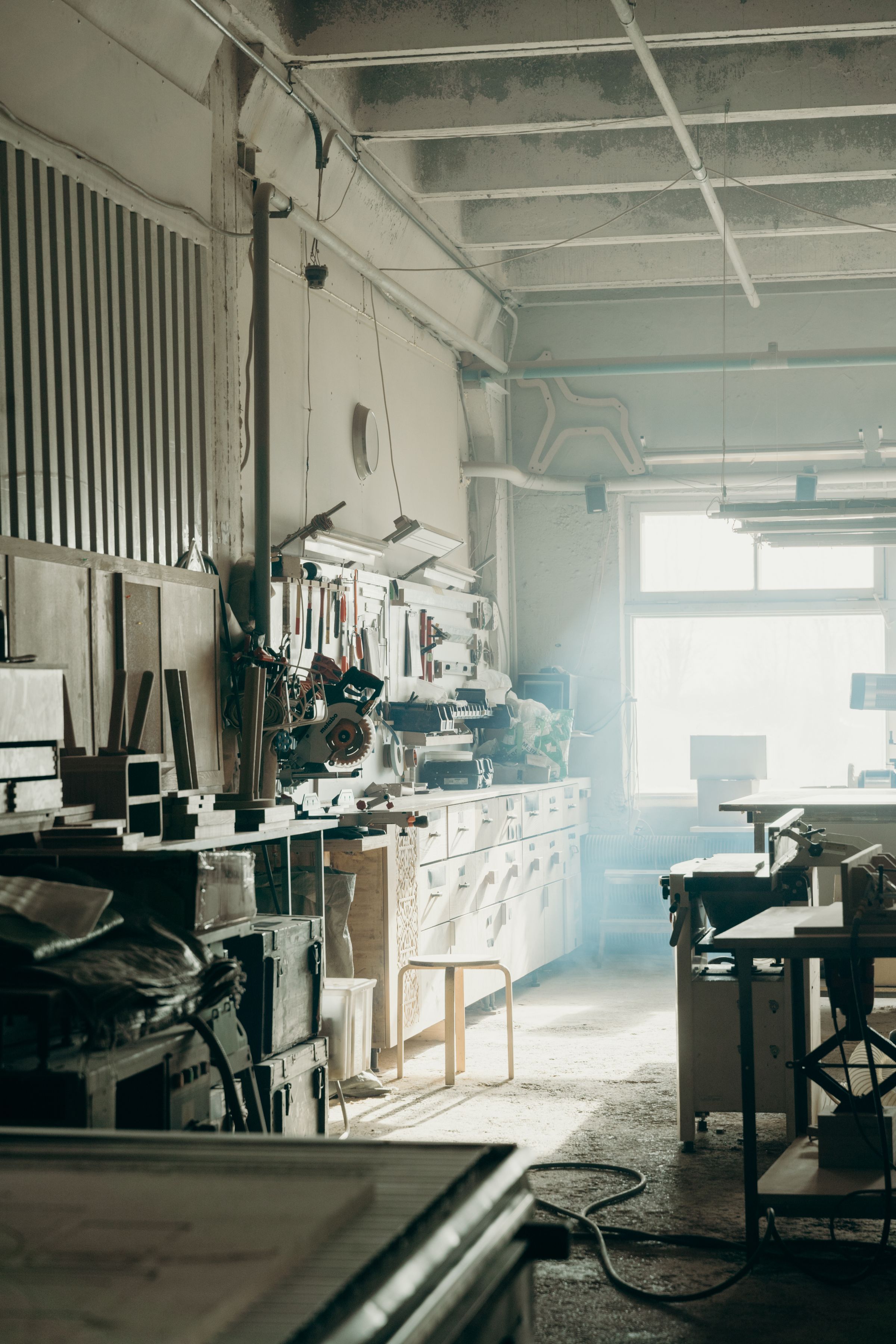 Daylight falling across a shared work surface and materials.